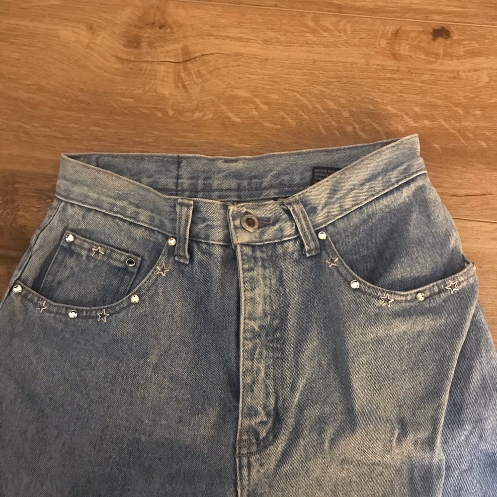 Vintage jeans with rig stone details.
